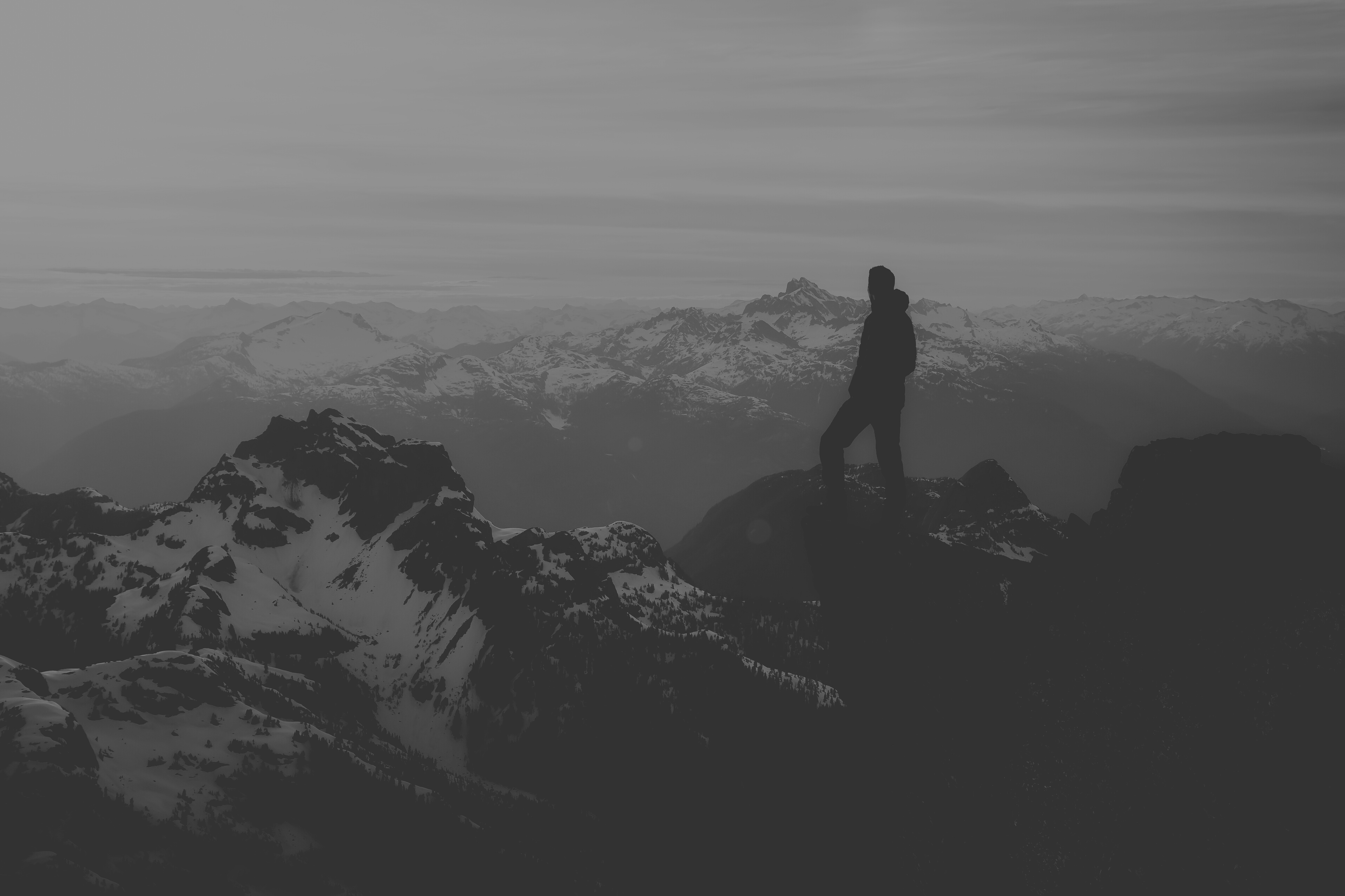 Person on Top of a Mountain Cliff